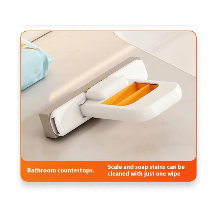 Cleaning tool with orange and white design on a bathroom countertop.