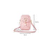 Pink crossbody bag with measurements on a white background