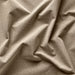 Close-up of beige fabric with folds