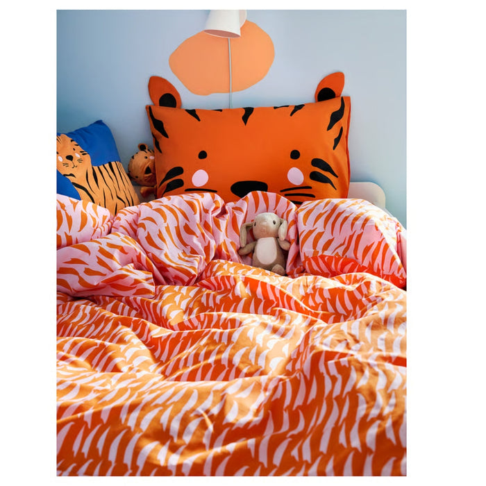 Children's bedroom with tiger-themed bedding and decor.