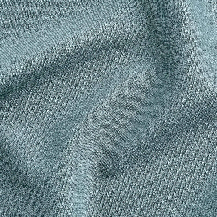 Close-up of teal fabric with visible texture