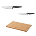 Two knives with black handles and a wooden cutting board on a white background