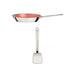 Copper frying pan with a silver handle and white spatula on a white background