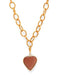 Gold chain necklace with a heart-shaped pendant on a white background