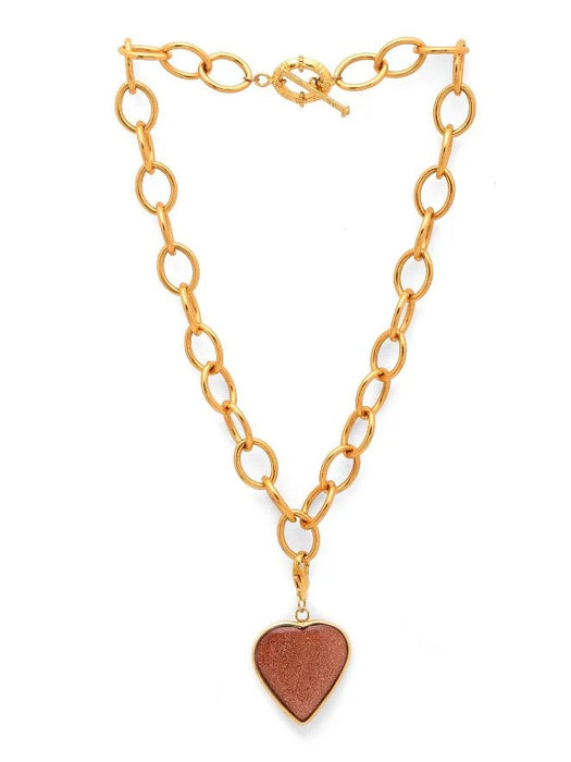 Gold chain necklace with a heart-shaped pendant on a white background