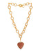 Gold chain necklace with a heart-shaped pendant on a white background