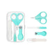 Turquoise nail care set with scissors, clipper, and other tools on a white background