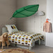 Child's room with green LÖVA bed canopy, bear pattern bedding and cloud decor