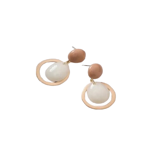 Pair of earrings with white and brown circular designs on a white background