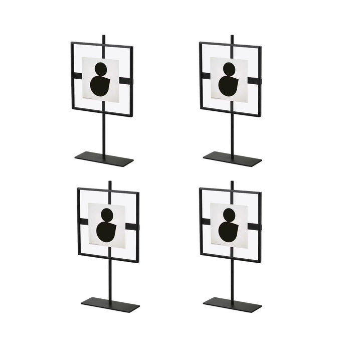 Four black and white target-like stands on a white background