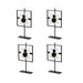 Four black and white target-like stands on a white background