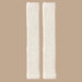 Pair of milky white plush leg warmers laid flat, showing soft texture and gathered ends - 