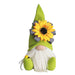 Green gnome figurine with a sunflower on a white background