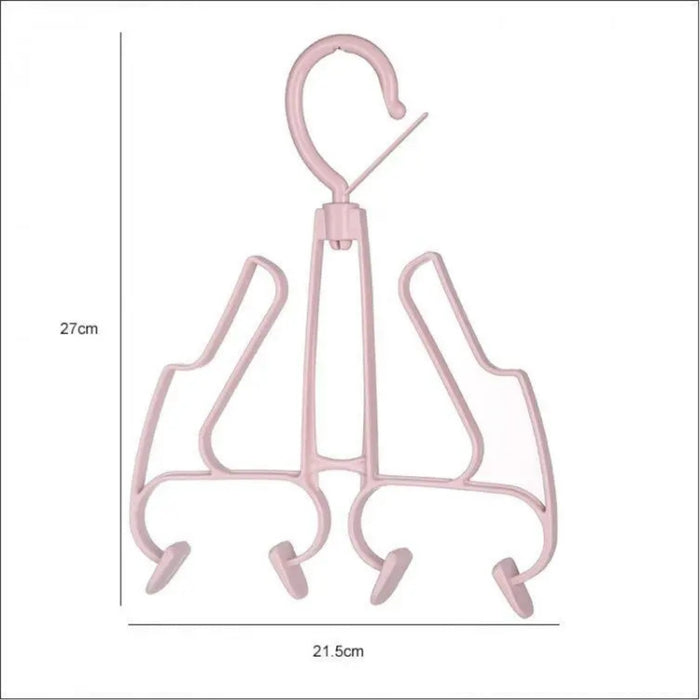 Pink metal hanger with four hooks on a white background