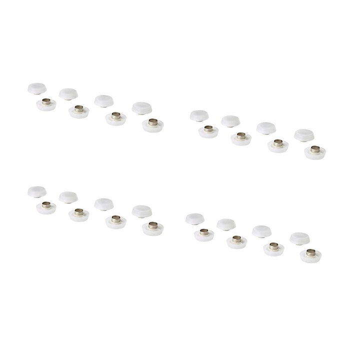 Heart-shaped arrangement of small white objects on a white background
