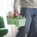 IKEA STACKSTOD Desk Organiser, light green, 32x18x16 cm, featuring a sturdy central handle and multiple compartments for organizing art supplies. The caddy holds paint bottles, brushes, glue, and various craft tools, making it ideal for artists, students, or hobbyists.-80598203