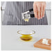IKEA VÄRDEFULL black garlic press open flat showing chamber for easy cleaning