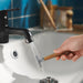 Chrome mixer tap with ÅBÄCKEN mist nozzle close-up sleek design on blue-tiled wall