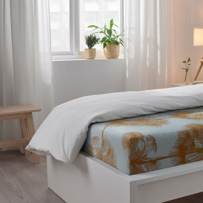 IKEA ÄNGLATRUMPET yellow flat sheet and pillowcase set 150x260/50x80 cm on a bed 90560742