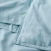 IKEA ÄNGSLILJA blue-grey duvet cover showing press-stud button closure detail