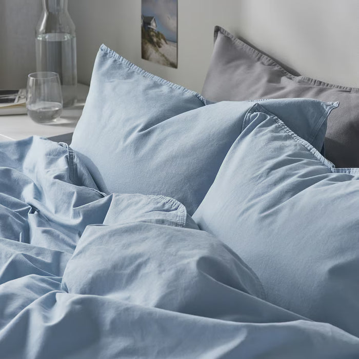 IKEA ÄNGSLILJA blue-grey bedding styled in modern bedroom with bedside table decor