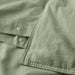 Close-up of IKEA ÄNGSLILJA grey-green duvet cover fabric with neatly stitched edges