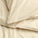 Folded IKEA ÄNGSLILJA cream duvet set showing envelope closure detail