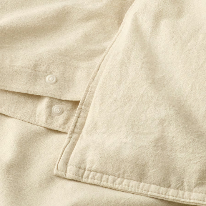 Close-up of IKEA ÄNGSLILJA soft natural cotton fabric showing pre-washed texture