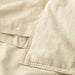 Close-up of IKEA ÄNGSLILJA soft natural cotton fabric showing pre-washed texture
