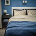 IKEA ÄNGSNEJLIKA duvet cover styled on bed in modern grey-beige bedroom setting
