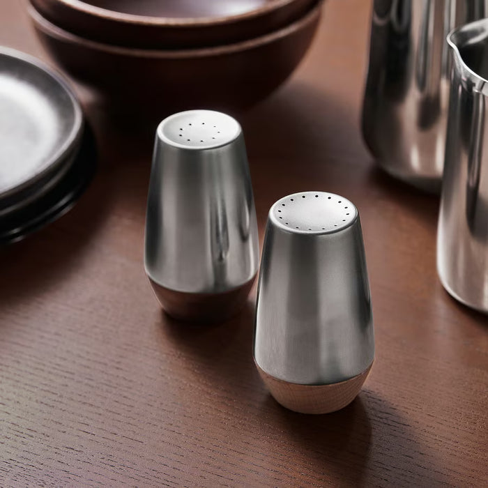  IKEA AFTONHAJ salt and pepper shakers on wooden dining table reflecting light matte gloss finish