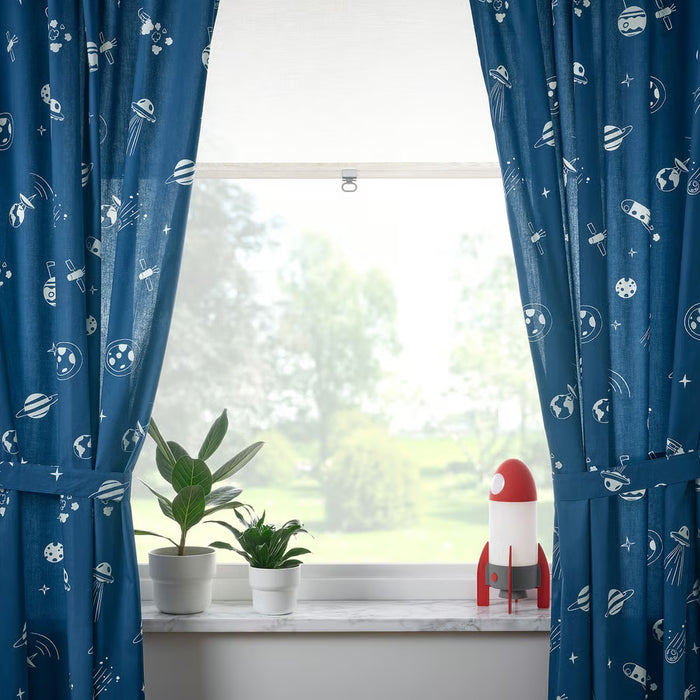 IKEA AFTONSPARV colour-changing rocket lamp with space-themed curtains in kids room