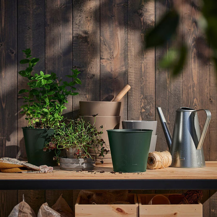 "Galvanized steel plant pots from IKEA ÅKERBÄR with corrosion-resistant finish and country-style look"