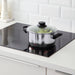 IKEA ANNONS pot on modern kitchen induction cooktop showing everyday cooking setup