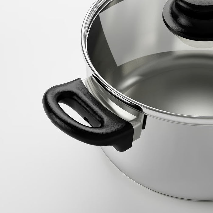 Close-up of IKEA ANNONS stainless steel pot polished surface and black handle detail