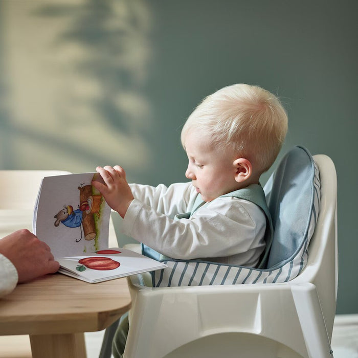 Blue and white striped IKEA ANTILOP supporting cushion designed for added child comfort in high chairs."