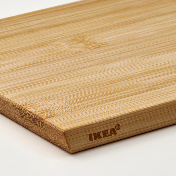 Close-up of IKEA APTITLIG bamboo chopping board smooth surface with IKEA branding stamped on wood