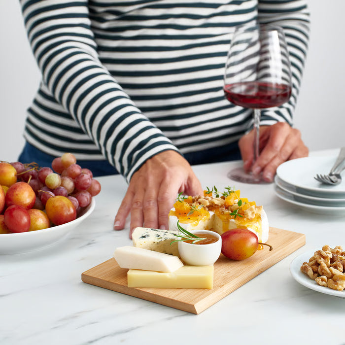 IKEA APTITLIG bamboo board used as snack platter with cheese fruit and dips casual entertaining