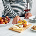 IKEA APTITLIG bamboo board used as snack platter with cheese fruit and dips casual entertaining