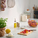  IKEA APTITLIG bamboo chopping board with fresh tomatoes on marble kitchen counter