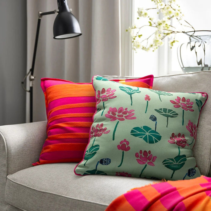 IKEA AROMATISK green cushion cover, 50x50 cm (20x20"), displayed on a sofa.70588997        
