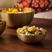 : IKEA AROMATISK gold bowl styled with fresh flowers and floating candles