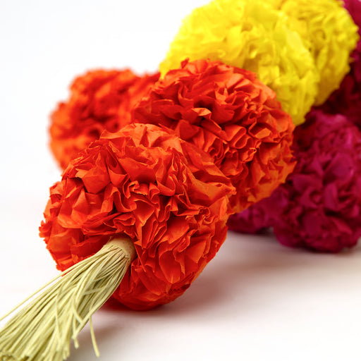 IKEA AROMATISK paper flowers close-up in vibrant orange, yellow and pink shades