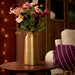 IKEA AROMATISK gold vase styled with fresh flowers on wooden table