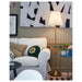 IKEA ÅRSTID brass floor lamp styled in modern living room with white sofa and colourful cushions