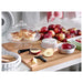 IKEA ARV BRÖLLOP serving stand with lid on a kitchen counter, with the lid removed beside it