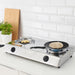 IKEA BÄCKBRÄSMA flat pan on gas hob beside griddle pan in modern kitchen setting