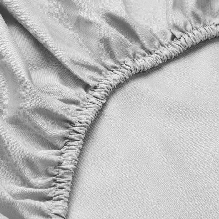 Close-up of IKEA BÄRGLIM fitted sheet fabric texture with finely woven elastic edge