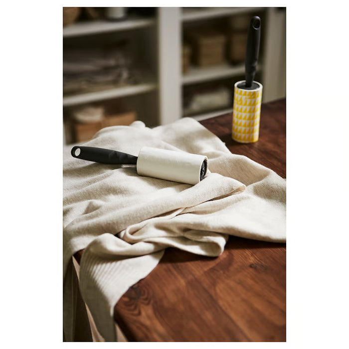 IKEA BÄSTIS grey lint roller side angle showing sheet layers and handle