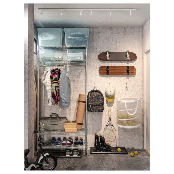 Sleek white BÄVE LED track system illuminating a living room